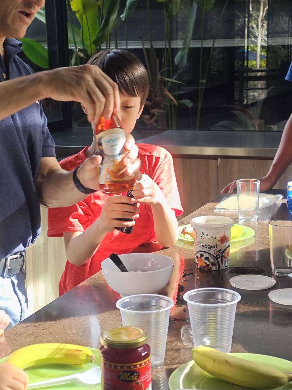 Children making healthy snacks with an EPS coach at holiday camp