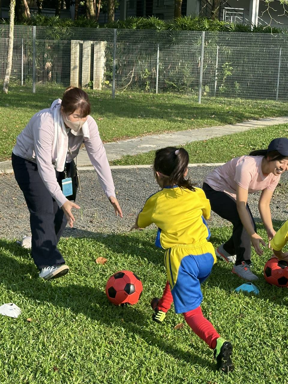 Toddler football class with parents joining in