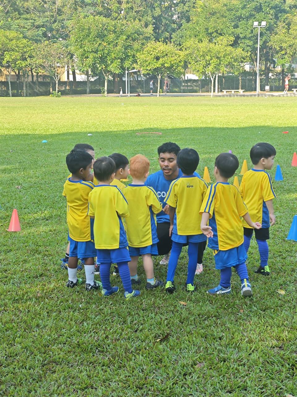 EPS juniors in a team huddle