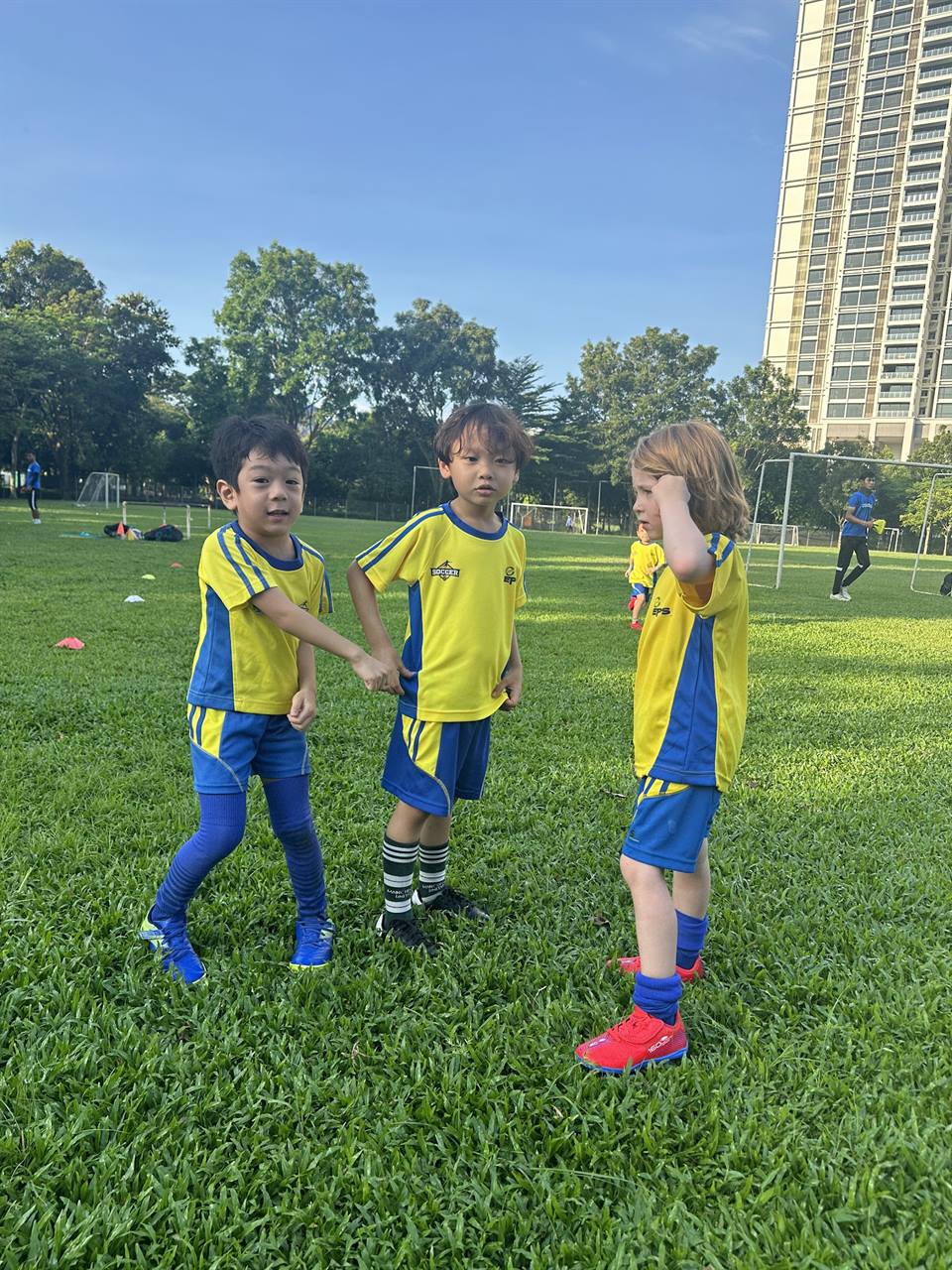 Junior players warming up on the field